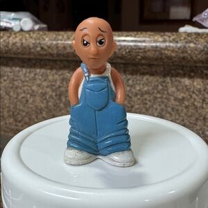 The figurine in the image is a Homies Mijos Series 1 "Antonio Baby Boy" mini-fig